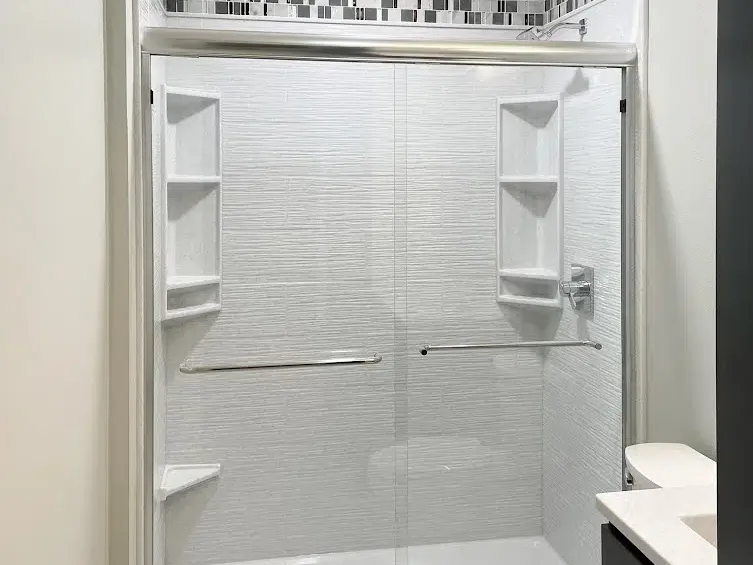 Tub-to-shower conversion with sliding glass doors